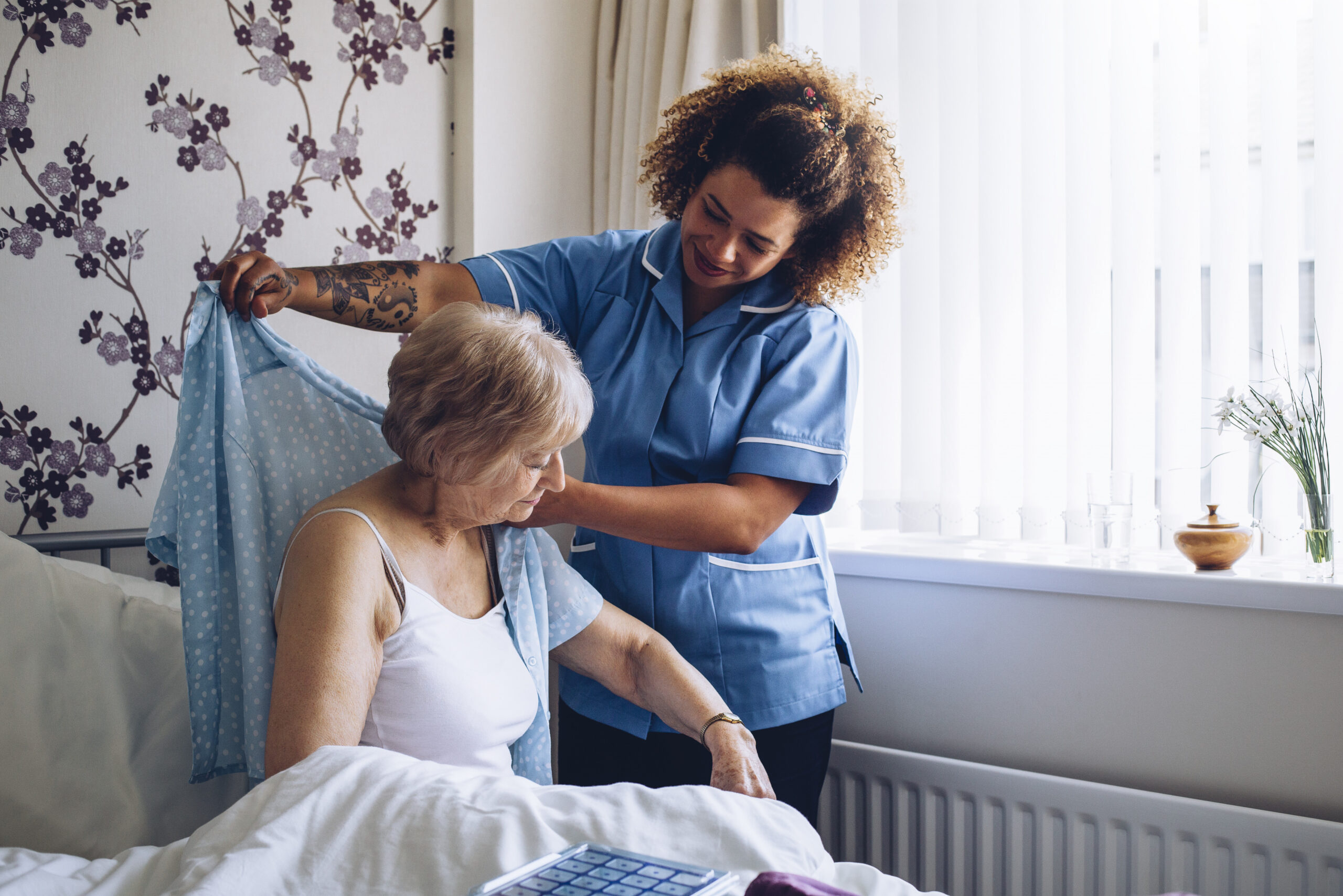 nurse helping lady